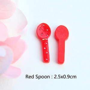 Close-up of red strawberry themed resin spoon miniature measuring 2.5x0.9cm for DIY dollhouse