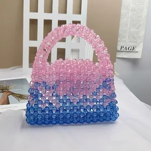 Handmade beaded handbag with pink and blue acrylic beads and smooth gradient design