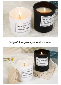 Detail of soy wax candles in glass jars with wooden lids on a stone base