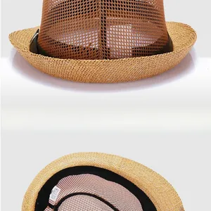Close-up of breathable mesh weave and black leather band with silver buckle on sun hat