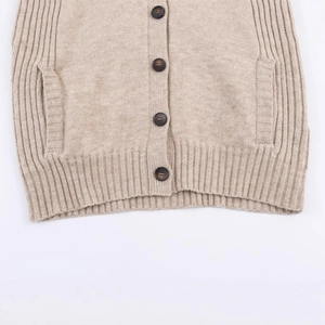 Beige ribbed knit cardigan with dark brown buttons and side pockets shown in front view