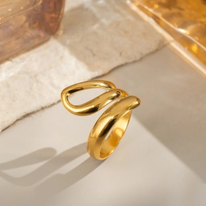 Minimalist geometric gold wave open ring with polished finish in modern style