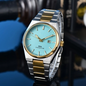Detailed macro view of tiffany blue waffle dial with date window and steel bracelet