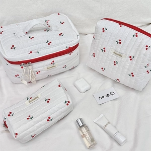 Three-piece quilted cherry print cosmetic bag set with red zipper and handle