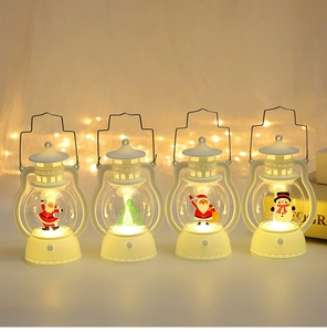 Detail of four white Christmas LED lanterns showing Santa and tree patterns with warm glow