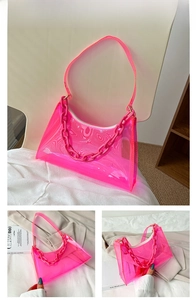 Macro detail of pink transparent PVC baguette bag with a chunky decorative chain