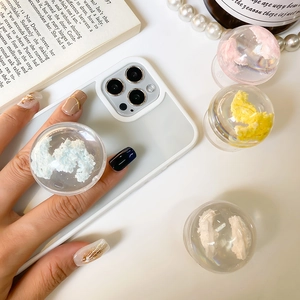 Minimalist crystal ball phone grip with cloud patterns and transparent folding base