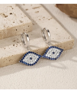 Detailed macro view of S925 sterling silver evil eye hoop earrings with blue gemstones