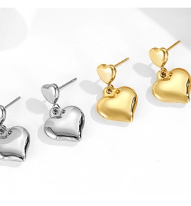Polished heart stud earrings in gold and silver finish shown on white background