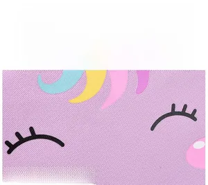 Detail of durable purple fabric with cute unicorn print and colorful rainbow mane
