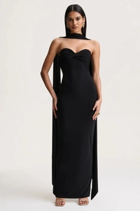Elegant black backless halter maxi dress with matching neck scarf and slim fit silhouette