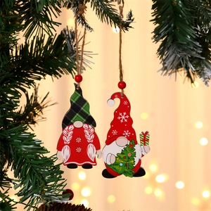 Close-up of painted wooden Christmas gnomes ornaments hanging with rustic hemp ropes