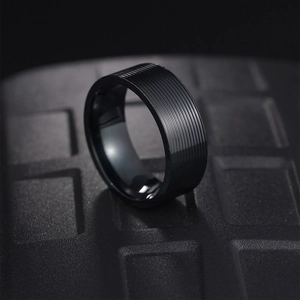 Black 8mm titanium steel ring for men with parallel textured grooves on black background