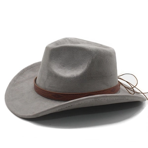 Detail of grey suede western cowboy hat featuring a brown leather band with embossed patterns