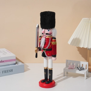 Classic wooden Nutcracker soldier ornament in red velvet uniform with gold fringe
