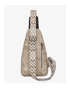 Close-up of khaki crossbody chest bag with vintage texture and zigzag wide strap