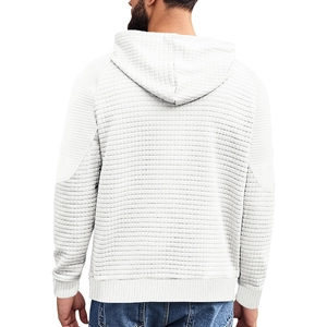 Detail of white men's hoodie featuring waffle texture fabric and ribbed hem from back view