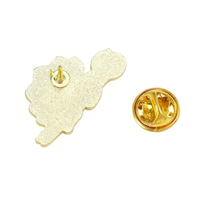 Back view of colorful dinosaur enamel pin with golden metal butterfly clutch and frosted texture