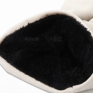 Thick beige ribbed knit beanie with warm black faux fur lining for thermal insulation
