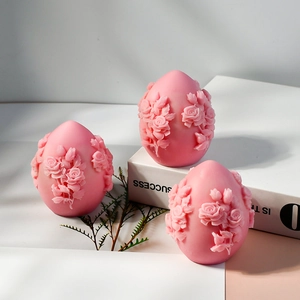 Pink rose embossed egg shaped candles in a three piece set for vintage home decor
