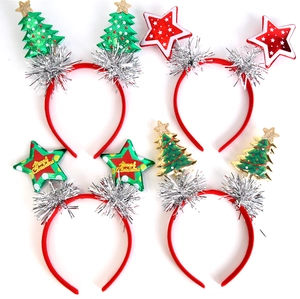 Detail of Christmas headband set with green sequin trees and red glitter stars