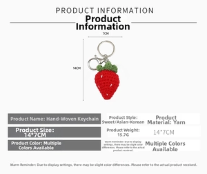 Detail view of handmade crochet strawberry keychain with metal ring and size measurements