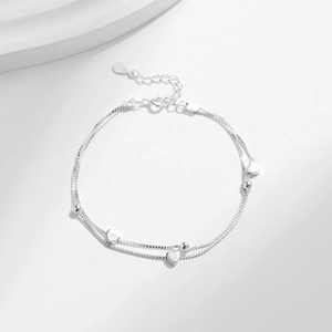 S925 sterling silver minimalist double-layer heart bracelet with beads on white surface