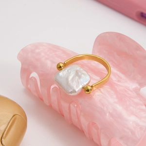Elegant gold titanium steel ring with a square freshwater pearl and golden beads accent
