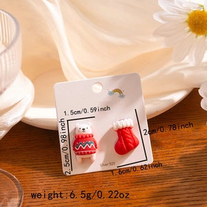 Detailed view of silver 925 Christmas bear and stocking earrings with size measurements