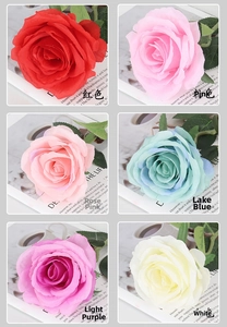 Detail of colorful velvet artificial roses in red, pink, blue, and purple for decoration