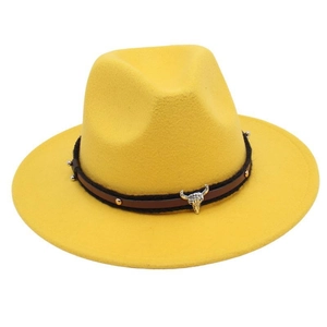 Detail of yellow wool fedora hat featuring a vintage bull head buckle on a leather band