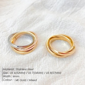 Macro detail of tricolor interlaced stainless steel rings with high polish finish