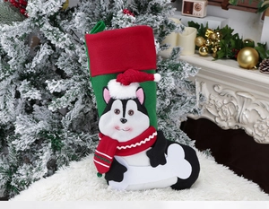 Detail of Christmas stocking featuring a 3D husky dog design on cozy holiday plush decor