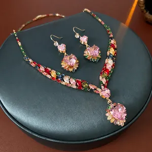 Pink heart pendant necklace and earrings set with colorful zircon stones in gold plating