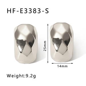 Irregular geometric silver earrings with polished facets measuring 25mm in size