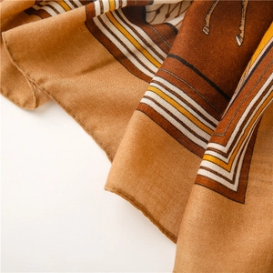 Detailed close-up of horse print scarf fabric showing twill weave and rolled edges