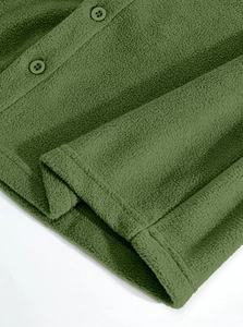 Detailed macro view of grass green fleece fabric texture and matching four-hole buttons