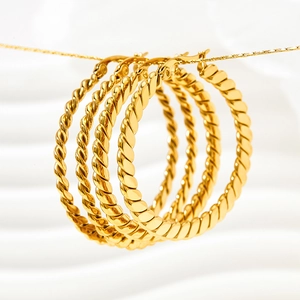 Golden matte twisted rope hoop earrings made of vacuum plated stainless steel