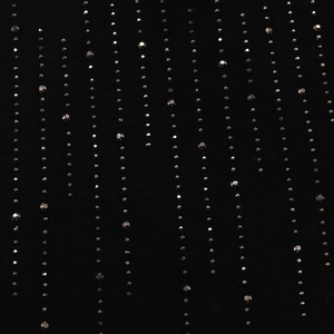 Detail of black cotton beanie showing vertical rows of dark grey rhinestones and beadwork