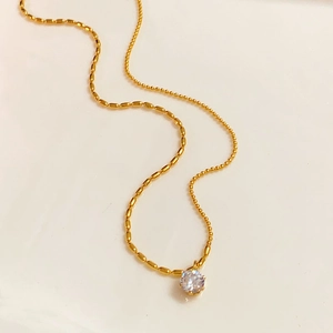 Minimalist gold necklace with six-prong round zircon pendant and elegant rice chain