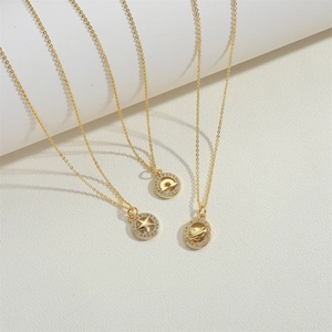 French vintage style gold necklace set with star, moon and saturn pendants with zircon