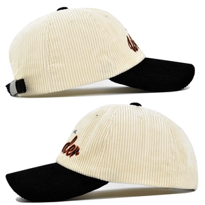 Detail of corduroy baseball cap showing side 3D Wonder embroidery and texture
