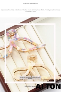 Macro shot of elegant acetate bow hair claw with durable golden metal teeth detail