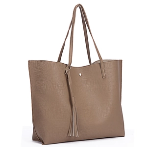 Close-up of mocha brown lychee texture tote bag with stylish tassel and magnetic snap closure
