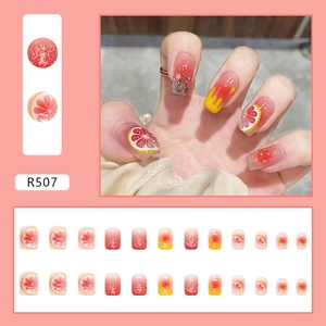 Short grapefruit style press-on nails set with 24 pieces in fresh orange and yellow tones