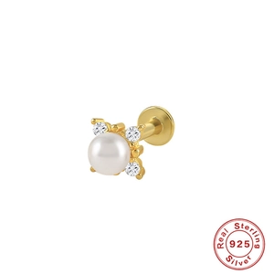 Detail of 925 sterling silver ear stud with white pearl and sparkling crystals