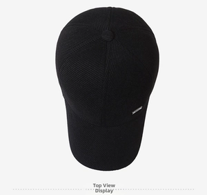 Top view of black striped baseball cap showing premium corduroy texture and metal logo