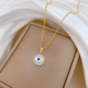 Luxury gold titanium steel necklace with a crystal-encrusted blue evil eye pendant