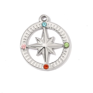 Close-up of star compass pendant in silver steel with colorful rhinestones detail