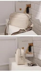 Front and side views of cream PU leather crossbody bag with wide woven strap and metal zips